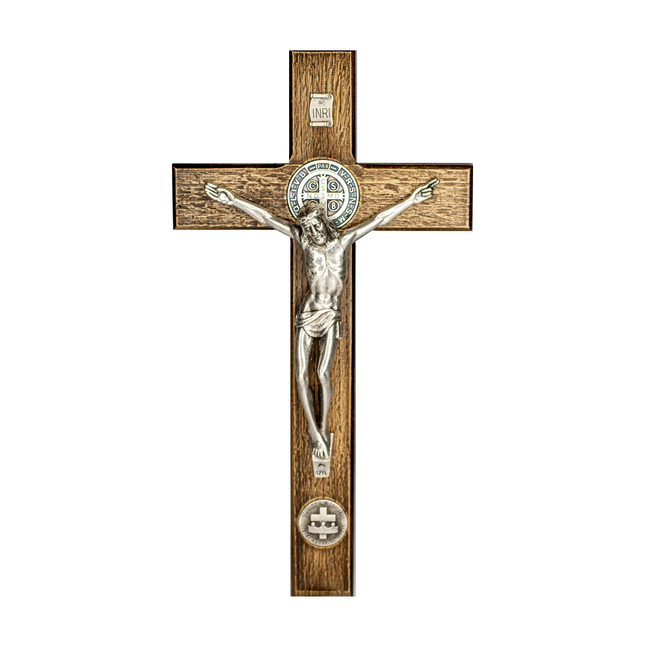 A hand held wooden crucifix with a metal representation of Jesus Christ, featuring two smaller circular designs on the bottom of the cross.